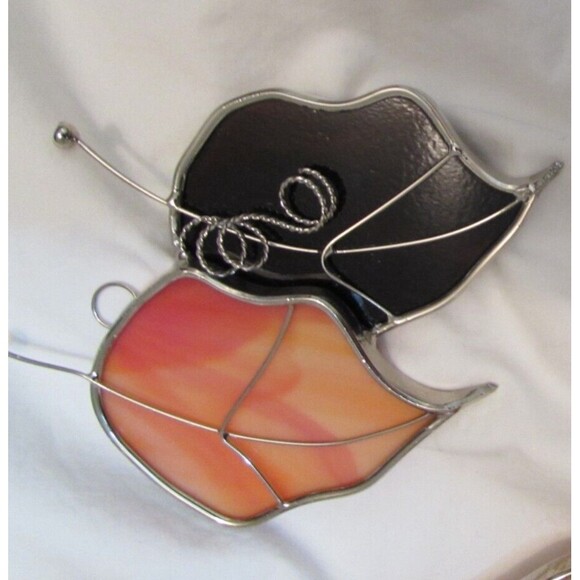 Stained glass leaves and lion handmade ornaments hang in window - Picture 3 of 7